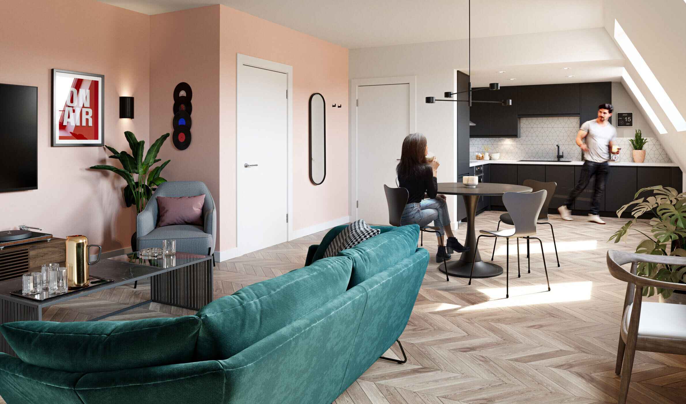 Depiction of the lounge and kitchen space at SONA with person sitting at the dining table talking to someone in the kitchen