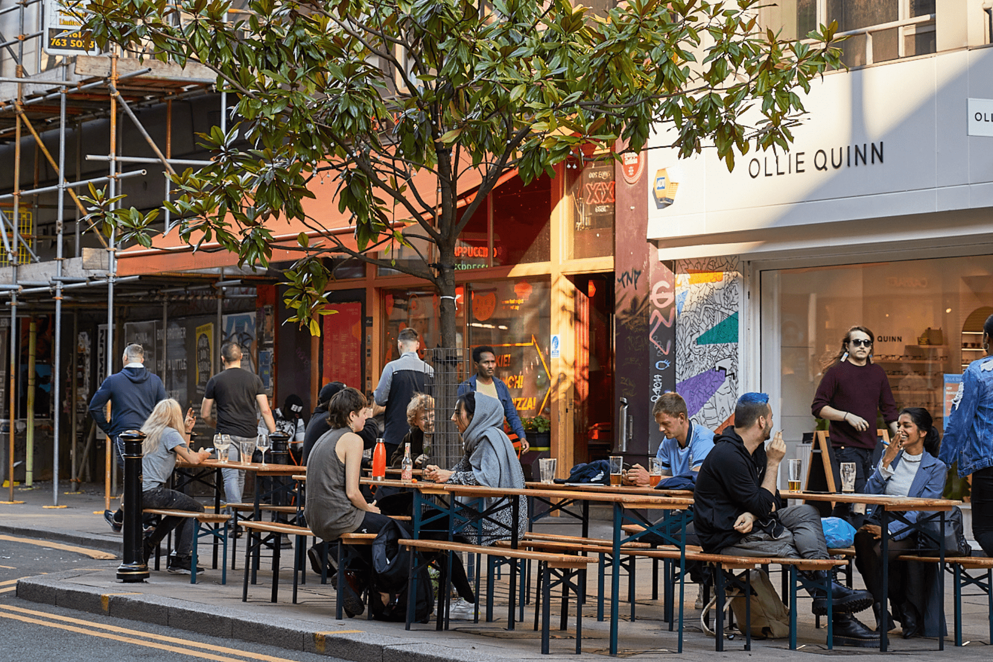 Northern Quarter Manchester people on benches