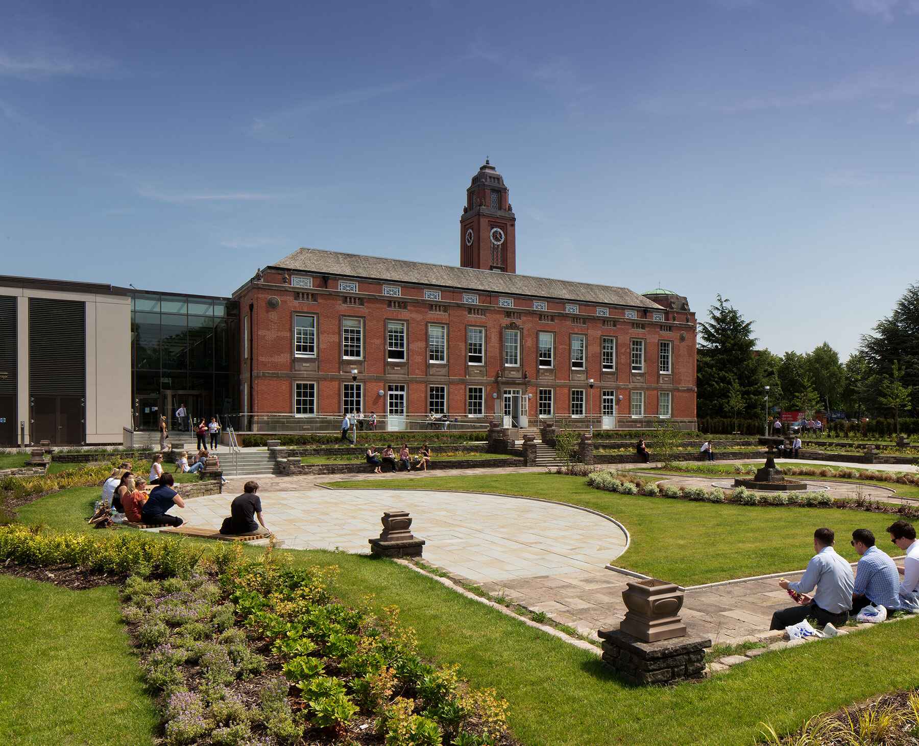 People sitting outside Trafford Town hall