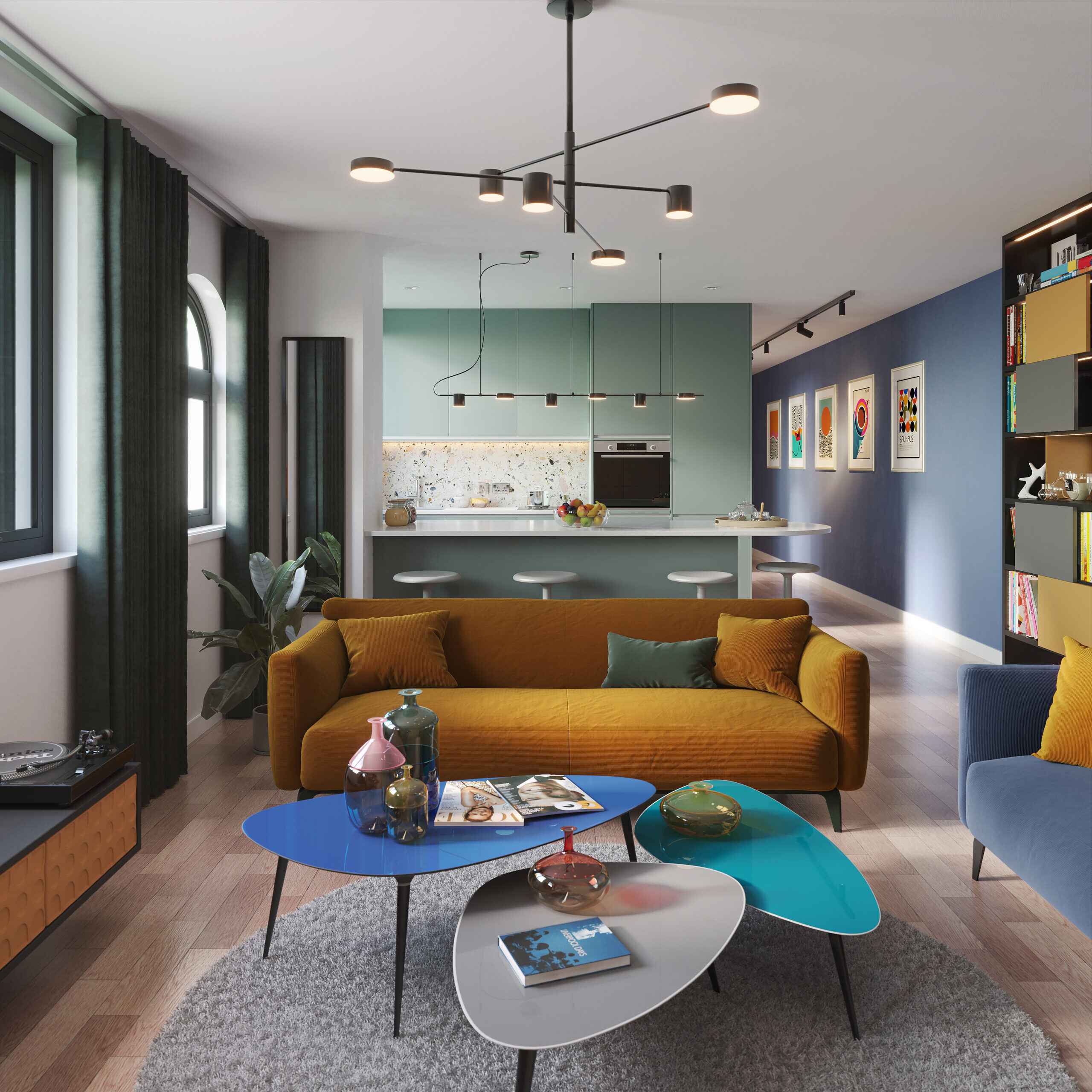 Depiction of Centric living room and kitchen showing orange sofa oval tables with books and vases on top