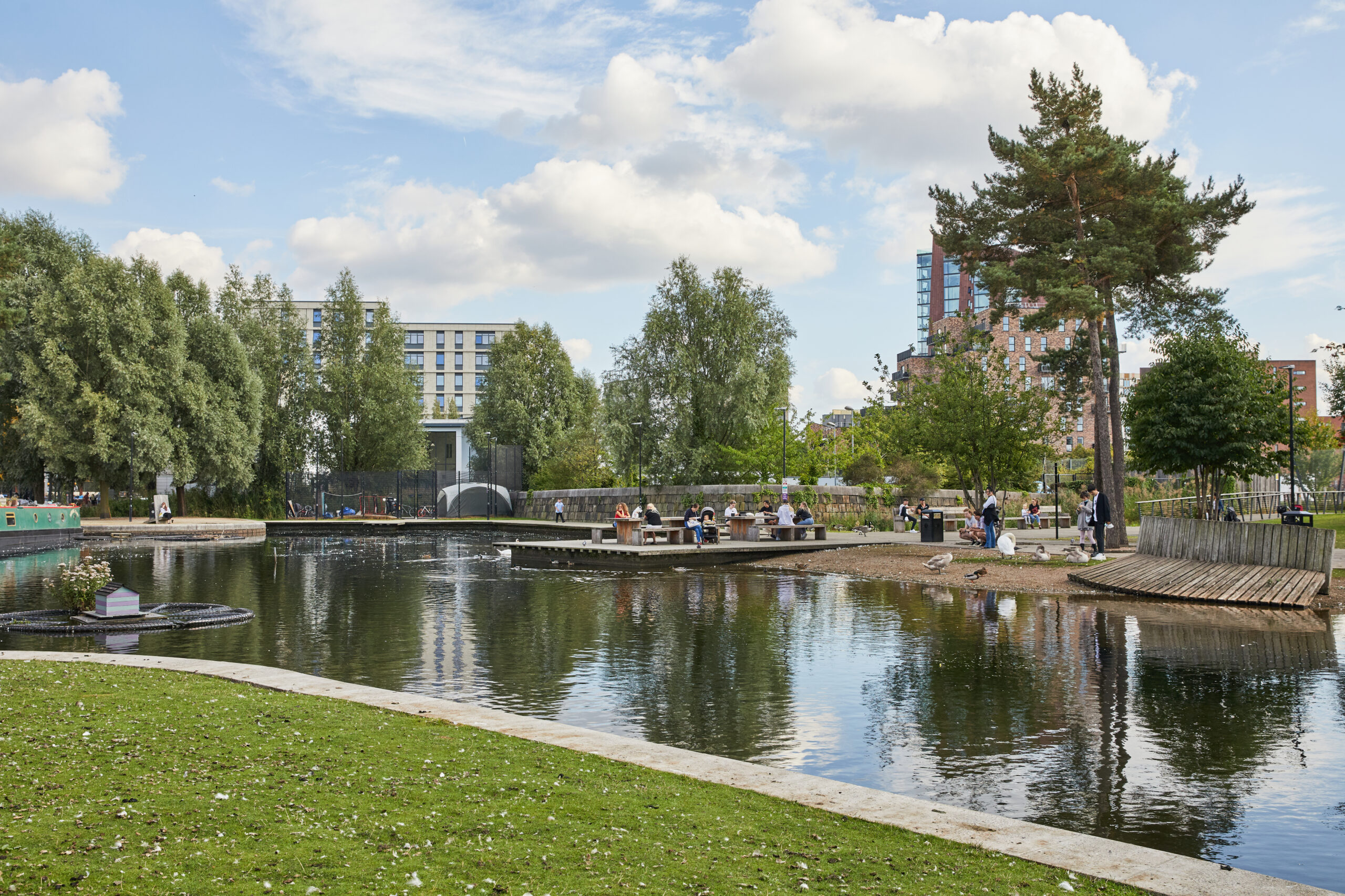 Ancoats Marina in Ancoats showing people and birds at the water's edge