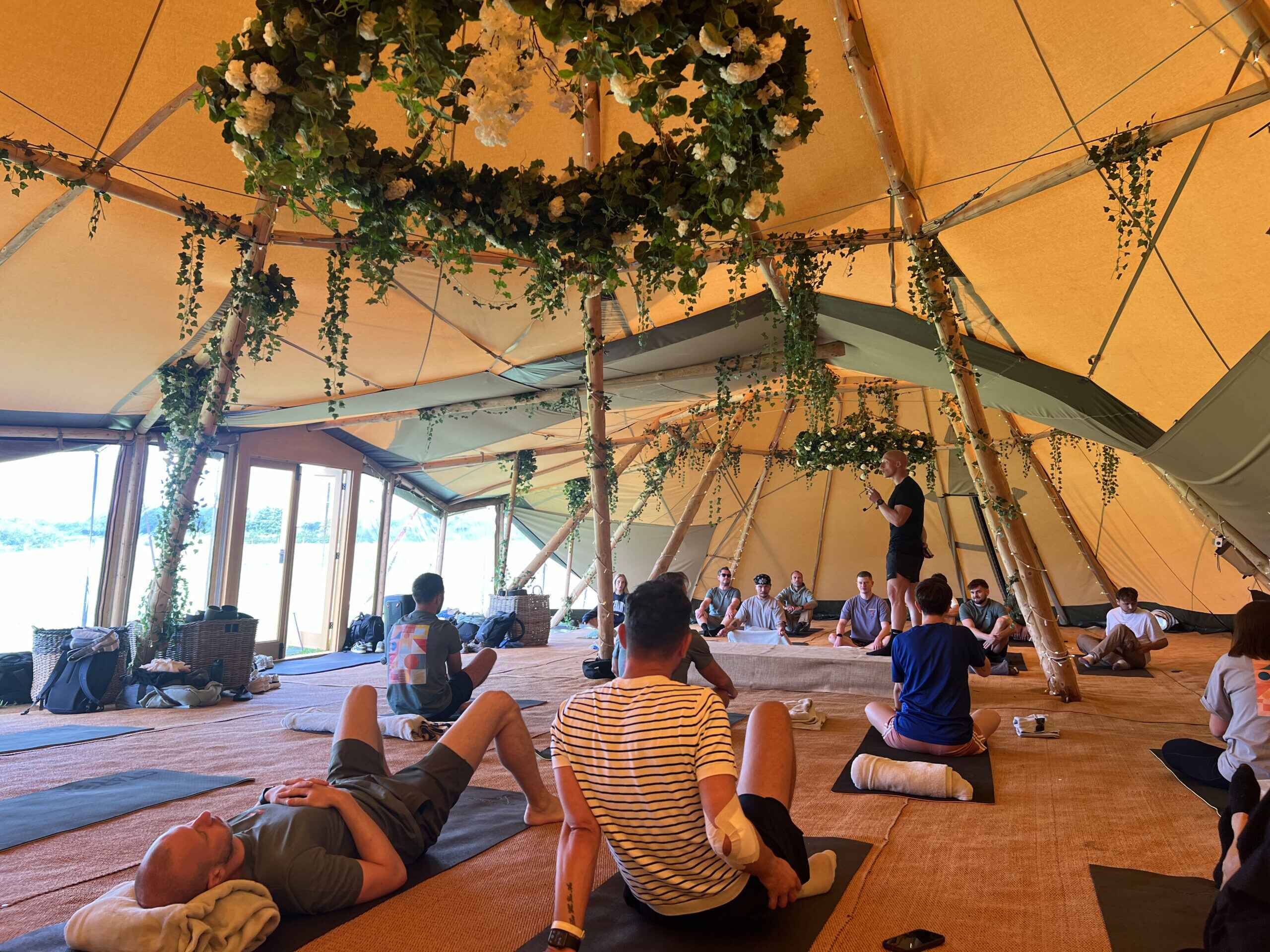 http://CERT%20Team%20enjoying%20a%20breathing%20workshop%20lying%20on%20yoga%20mats%20inside%20a%20tipi%20tent